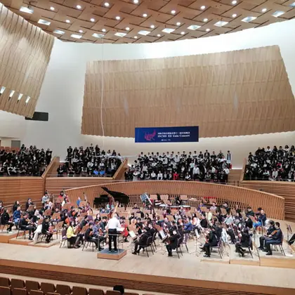 The school choir performing on a concert hall stage