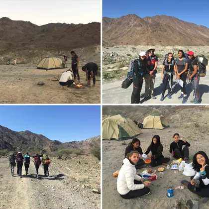 Students walking through rocky terrain on an expedition