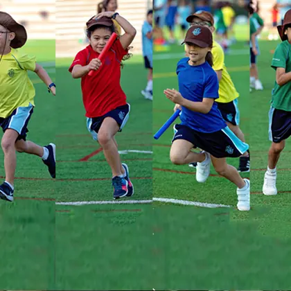 Junior students racing on the field on sports day